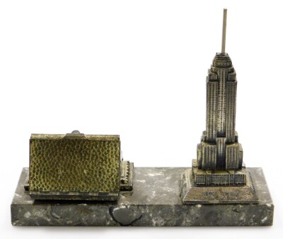 An Art Deco cigarette dispensing desk stand, formed with a cast spelter model of the Empire State Building New York on a black marble base, 19cm high, 22cm wide. - 3