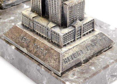 An Art Deco cigarette dispensing desk stand, formed with a cast spelter model of the Empire State Building New York on a black marble base, 19cm high, 22cm wide. - 6