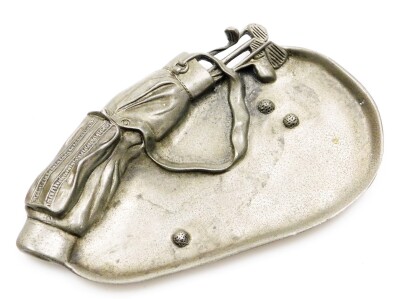 A golfing interest pewter ash or pin tray, cast with golf clubs in caddy bag, and three balls in a bunker, 16cm x 9cm.