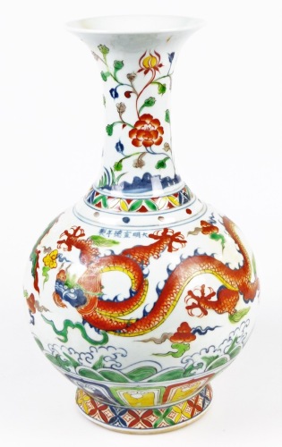 A Chinese vase, decorated with dragons, 39cm high.