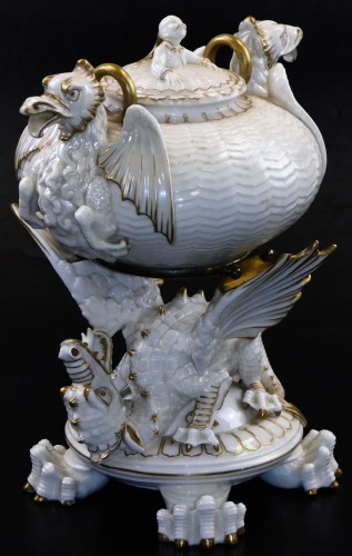 A second period Belleek Dragon tea kettle, cover and stand, second period black mark, 1891-1926, decorated with the highlights, picked out in gold, 35cm high. (3) For an example of a similar dragon tea kettle on stand see Irish Porcelain page 107.
