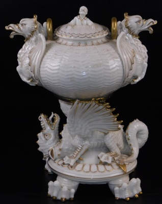 A second period Belleek Dragon tea kettle, cover and stand, second period black mark, 1891-1926, decorated with the highlights, picked out in gold, 35cm high. (3) For an example of a similar dragon tea kettle on stand see Irish Porcelain page 107. - 2