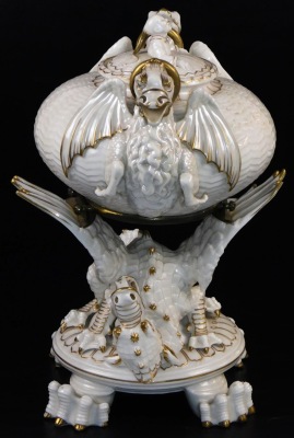 A second period Belleek Dragon tea kettle, cover and stand, second period black mark, 1891-1926, decorated with the highlights, picked out in gold, 35cm high. (3) For an example of a similar dragon tea kettle on stand see Irish Porcelain page 107. - 3