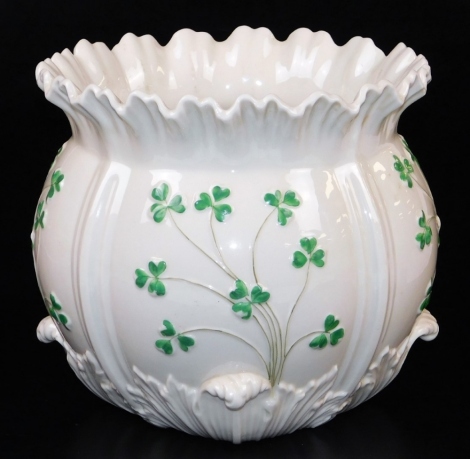 A second period Belleek shamrock moulded jardiniere, the moulded detail picked out in green, black marked second period 1891-1926, 23cm diameter.