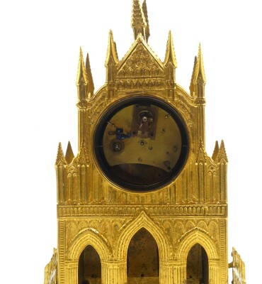 A late 19thC brass cased cathedral mantel clock, circular cream painted dial bearing Roman numerals in white reserves, clockwork movement, the case of Gothic form, no key, 36cm high. - 2