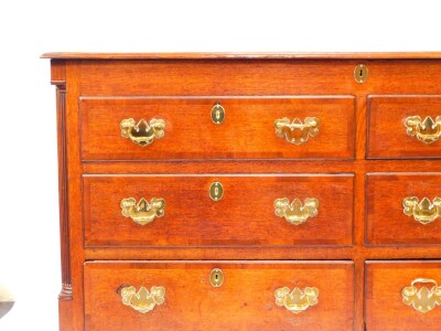 A George III oak and mahogany cross banded Lancashire chest, with a hinged top above four dummy drawers and two frieze drawers, raised on bracket feet, 92cm high, 156cm wide, 55.5cm deep. - 2