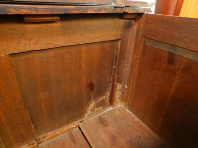 A George III oak and mahogany cross banded Lancashire chest, with a hinged top above four dummy drawers and two frieze drawers, raised on bracket feet, 92cm high, 156cm wide, 55.5cm deep. - 4