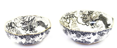 A pair of Royal Crown Derby porcelain graduated bowls, decorated in the Black Aves pattern, of octagonal form, A1310., printed marks, 21cm diameter, 24cm diameter respectively.