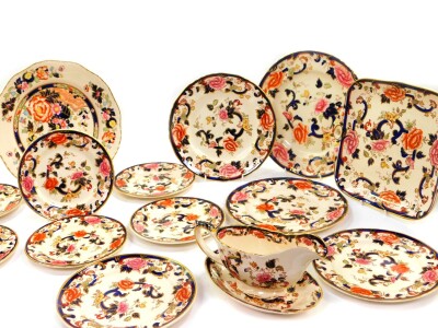 A group of Masons Ironstone decorated in the Mandalay pattern, comprising a sauce boat on stand, dinner plate, bread plate, a pair of dessert and side plates, and six tea plates, together with a dinner plate decorated in the Mandarin pattern. (15)