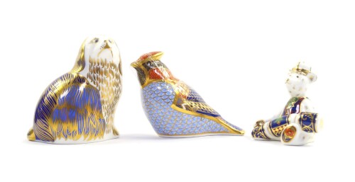 A Royal Crown Derby imari paperweight modelled as the Christmas Mini Teddy Bear, boxed, an imari paperweight modelled as a Cardinal Bird (AF), and an imari King Charles Spaniel, seconds. (3)