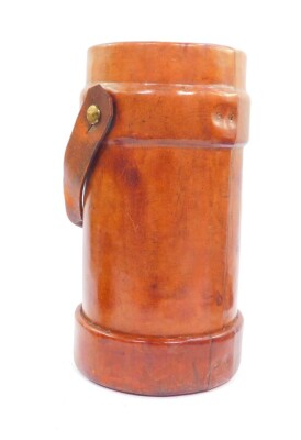 A BH & G Limited early 20thC leather powder keg, No 73 1., showing an armorial to the front and letter N., 3-1929, 39.5cm high. - 2