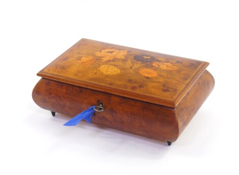 A Sorrento 20thC burr walnut musical jewellery box, with floral marquetry inlaid to the lid, 20cm wide, 13cm deep.