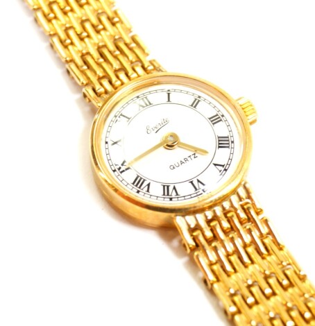 An Everite 9ct gold cased lady's wristwatch, circular white dial bearing Roman numerals, Quartz movement, on a 9ct gold bracelet strap, 17.5g all in.