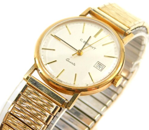 A Timex 9ct gold cased gentleman's wristwatch for C Bright, champagne dial with gold batons, centre seconds, date aperture, back plate presentation engraved, a textured elasticated plated strap, cased.