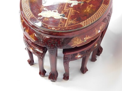 A Chinese red lacquer and 'Shibyama' oval coffee table, decorated with figures and pagodas in a garden setting, raised on six tapering square legs and lion's paw feet, 52cm high, 120cm wide, 77cm deep., together with a Chinese red lacquer and Shibyama set - 4