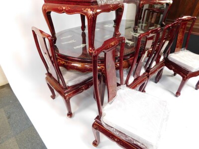 A Chinese red lacquer and 'Shibyama' dining suite, decorated with figures in a garden, flowers and geometric motifs, the table of oval form, raised on cabriole legs, 78cm high, 184cm wide, 106cm deep, together with eight dining chairs, with loose cushion - 4