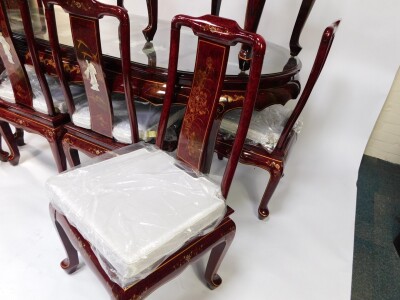 A Chinese red lacquer and 'Shibyama' dining suite, decorated with figures in a garden, flowers and geometric motifs, the table of oval form, raised on cabriole legs, 78cm high, 184cm wide, 106cm deep, together with eight dining chairs, with loose cushion - 5