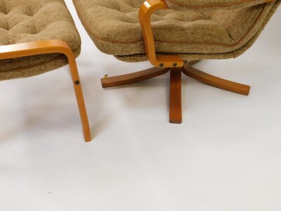 A late 20thC bentwood swivel armchair, upholstered in button back oatmeal fabric, raised on a five pronged base, together with a matching stool. (2) - 3