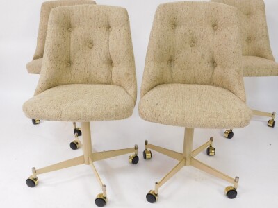 A set of four American late 20thC swivel single dining chairs, upholstered in button back oatmeal fabric, raised on a cream four pronged base, on castors, base numbered 85724, bears label for S***ville Furniture Co, Clarksville, Texas. - 2