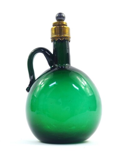 A Georgian Bristol green glass wine jug, with brass mount and capped cork stopper, 21.5cm high.