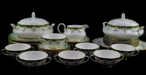 A Royal Doulton porcelain part dinner service decorated in the Ashmont pattern, comprising an oval meat platter, a pair of vegetable tureens and covers, soup tureen cover, gravy boat on stand, eight dinner and dessert plates, and side plates, seven soup c