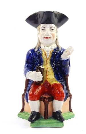 A late 19thC Sampson character jug modeled as The Squire, pipe lacking, modeled seated on a triform base, 27cm high.