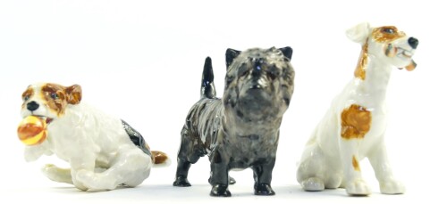 A Royal Doulton figure modeled as a Cairn Terrier HN1035, and two Royal Doulton figures of character dogs, HN1159 and HN1097. (3)