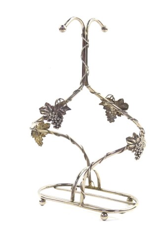 A vintage French Silea silver plated twin wine bottle holder, of scrolling vine form, 33cm high.