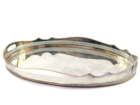 A silver plated oval twin handled galleried tray, 62.5cm wide, 40cm deep.