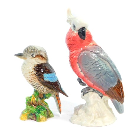 A Beswick pottery figure modeled as a cockatoo, No 1180, and another modeled as a kookaburra, No 1159, printed and impressed marks. (2)