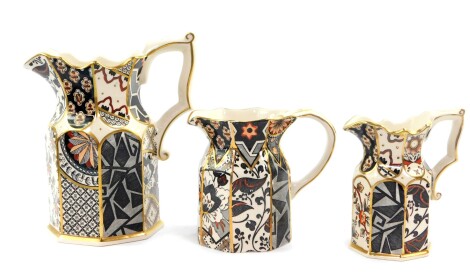 A set of three Masons graduated ironstone jugs decorated in the Applique pattern, printed marks.