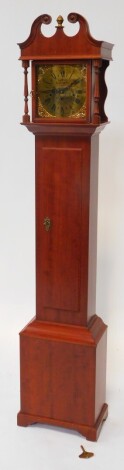 E J Goodfellow, Wadebridge. A mahogany cased Grandmother clock, the circular brass dial with cherub spandrels, chapter ring bearing Roman numerals, eight day movement with Westminster chimes, the hood and case of plain architectural form, 151cm high.