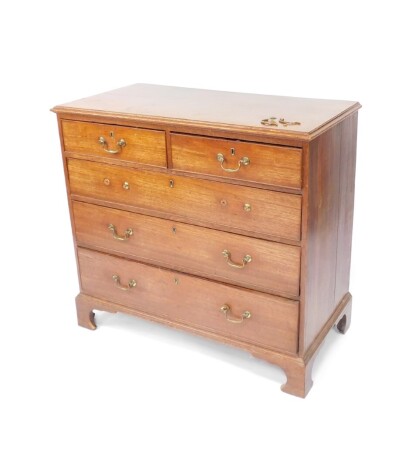 A George III oak chest, of two short over three long graduated drawers, raised on bracket feet, 93cm high, 100.5cm wide, 51.5cm deep.