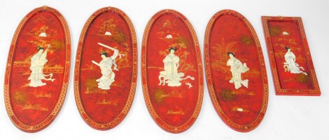 Four Chinese and red lacquer Shibyama oval panels, decorated with figures in a garden setting, 91cm high, 35cm wide, together with a rectangular panel similarly decorated, 60.5cm high, 25cm high.