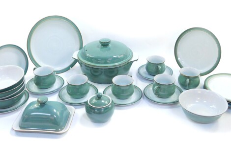 A group of Denby pottery decorated in the Regency Green pattern, comprising a tureen and cover, butter dish and cover, preserve pot and cover, dinner plate, four dessert plates, five cereal bowls, six tea cups and five saucers and two tea plates.