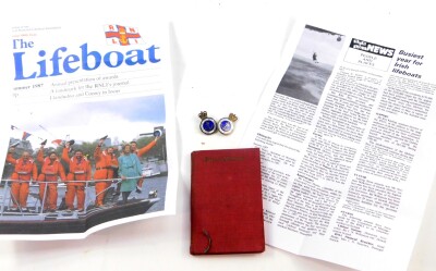 Two Royal National Lifeboat Institution badges, silver badge 1967 and gold badge 1979, awarded to Norman Wells, Honorary Life Governor, and Former Honorary Secretary of The Kingston On Thames Branch of The RNLI.