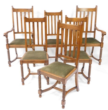 A set of six early 20thC oak dining chairs, stamped M. Dovey, with slat backs, green velour drop-in seats, raised on spiral twist front legs, united by curved H framed stretcher, comprising a pair of carver chairs and four single chairs.