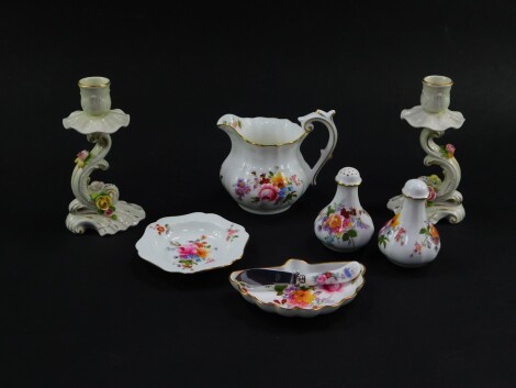 A group of Royal Crown Derby porcelain decorated in the Derby Posies pattern, comprising a milk jug, salt and pepper, fan shaped butter dish and knife, boxed, and a hexagonal dish, together with a pair of Rudolph Kammer porcelain candlesticks, of S scroll