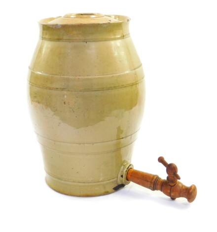 A late 19thC pale green stoneware spirit barrel, 3 gallon, with wooden tap, 40cm high.