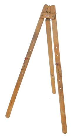 A Tri-ang wooden easel, with adjustable pegs, 126cm high.