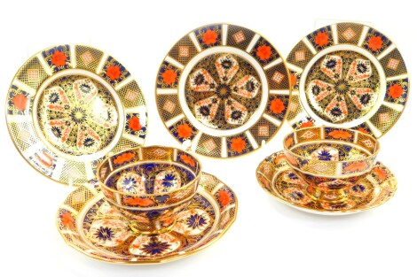 A group of Royal Crown Derby tea wares, decorated in the Old Imari pattern, no. 1128, comprising a pair of tea cups, two saucers in sizes, and three tea plates. (7)