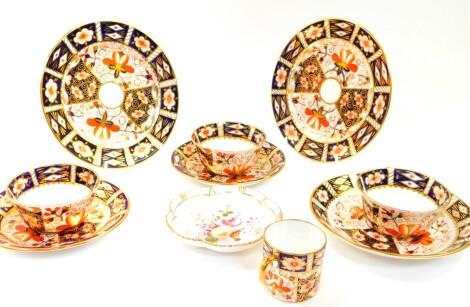 A group of Royal Crown Derby porcelain tea wares, decorated in the Imari pattern, no. 2151, comprising three tea cups and saucers, coffee can, and a pair of tea plates, together with a cricket dish decorated in the Derby Posies pattern. (9)