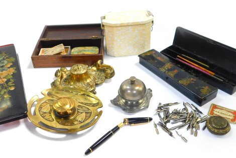 An Indian late 19thC rosewood and inlaid writing box, Victorian floral printed lacquer glove box, two chinoiserie lacquer pen boxes, pens and nibs, a shop counter bell, a German Art Nouveau brass inkwell on stand, decorated with water lily, continental br