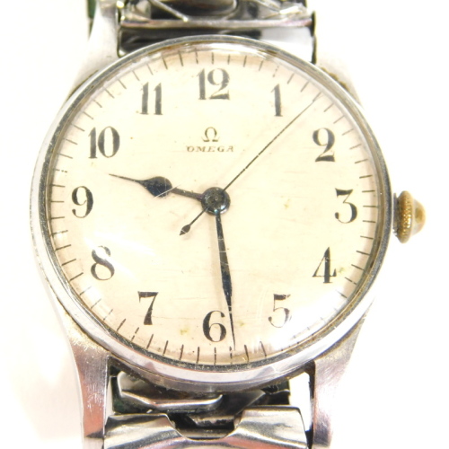 An Omega Air Ministry gentleman's wristwatch, with a white dial with Arabic numerals, stainless steel case, with associated strap, engraved to the reverse A M, 6B/159,3495/42, the dial 3cm diameter.