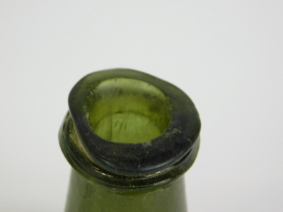 An 18thC green onion shaped glass wine bottle, with a tapering neck, 18cm high. - 2