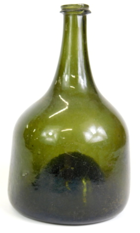 An 18thC green onion shaped green glass wine bottle, 21.5cm high.