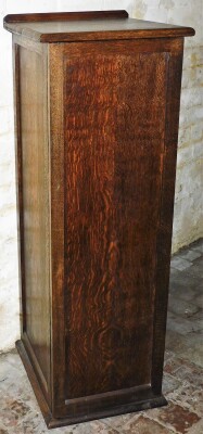 An oak ply collectors cabinet, with an arrangement of thirteen numbered drawers behind single door, 116cm high, 40cm wide, 46cm deep. - 2