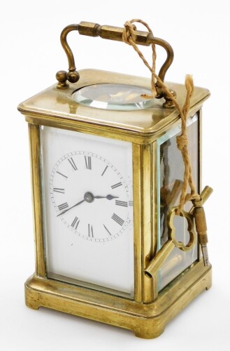 A late 19thC brass cased carriage timepiece, with a rectangular white enamelled dial, with Roman numerals and blue hands, key wind, 11cm high, 7cm wide, 6.5cm deep.