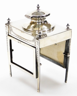 An early George V silver ink stand of neo classical design, having a raised inkwell on a four leg stand, with urns, oval patera and bell husk pendants, the legs tied by revolving card cases to the front and rear of the frame, maker John Round & Son, Sheff - 3