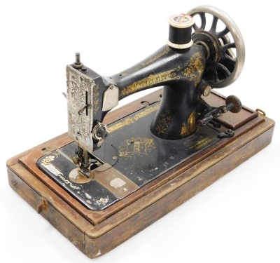 A marquetry sewing table, with musical lift top and a cased sewing machine (2). - 2